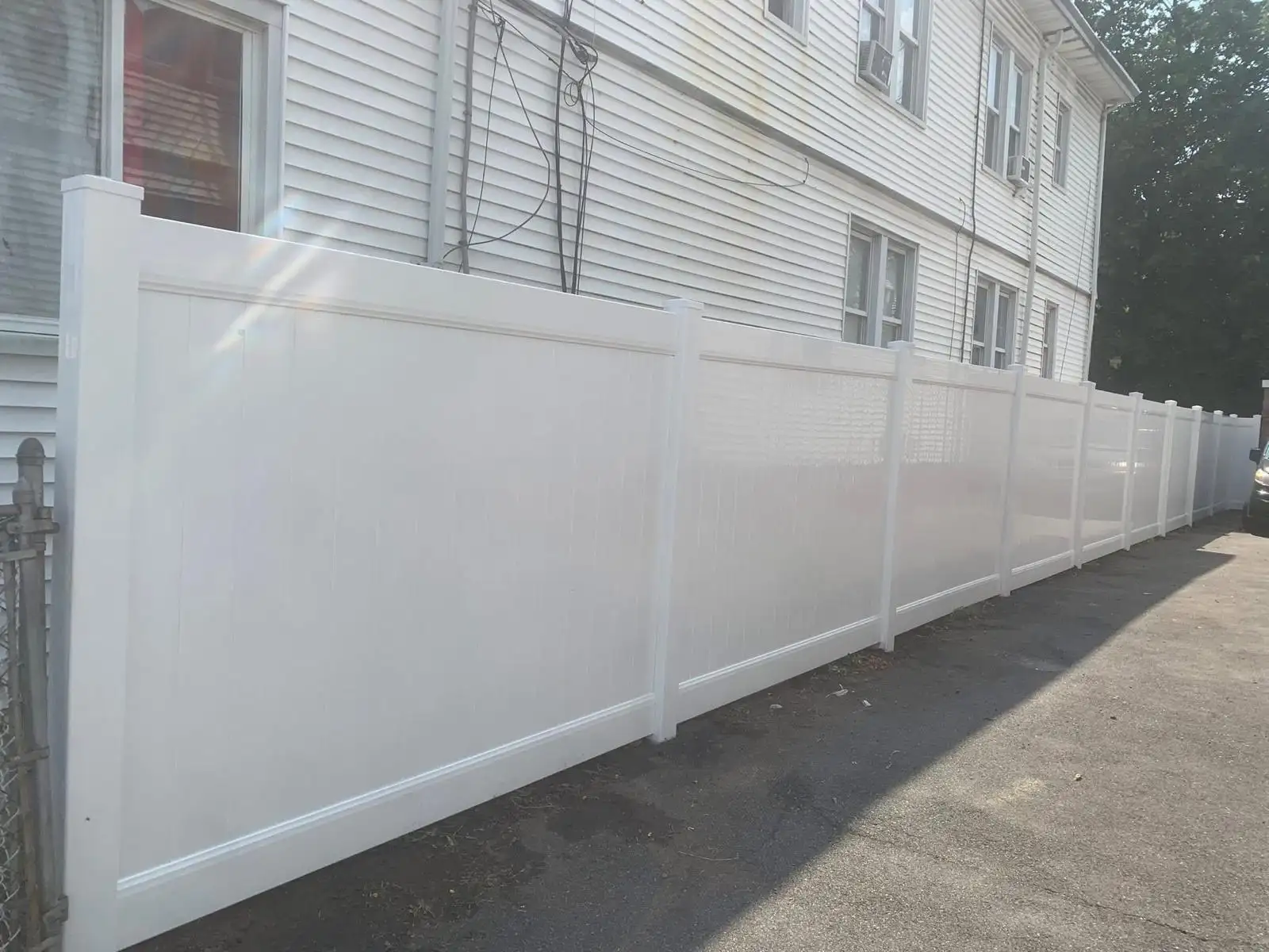 White vinyl fence along house — Arrochar, Staten Island